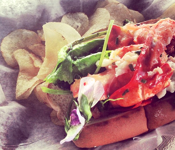 What could possibly make a lobster roll tastier? Butter: lots of it, and a nice cool pinot grigio.