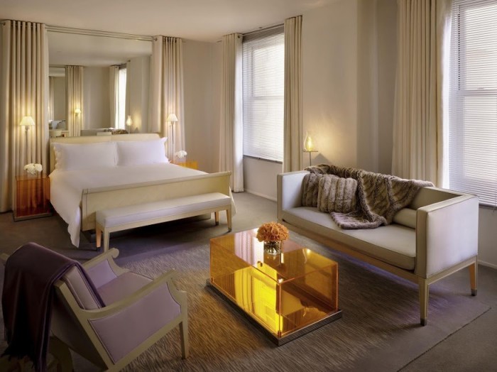Rooms at the Clift feature Philippe Starck-designed English sycamore sleigh beds, dressed in crisp white 300-thread-count sheets. (Courtesy of Morgans Hotel Group)
