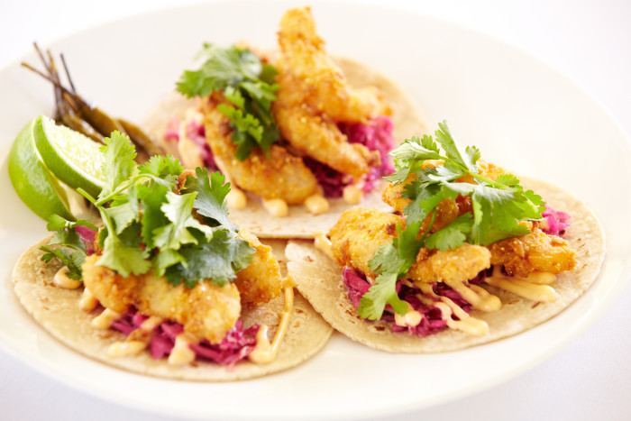 A house favorite, the crispy petrale sole tacos are topped with sweet and sour cabbage, cilantro, and spicy aioli. (Photo credit: Solage Calistoga) 