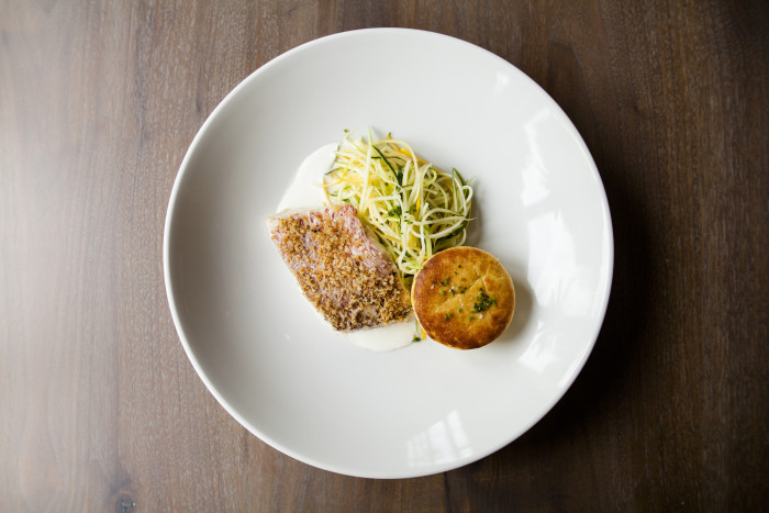 Chef Dominic Rice’s local red snapper is accompanied by zucchini “noodles” and a creamy spoon bread. (Photo credit: SLATE)