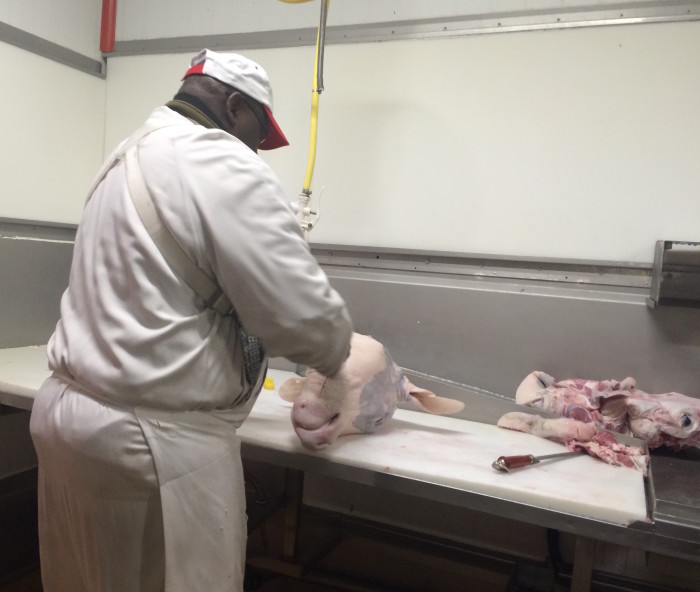 This butcher broke down a tête de veau, a French delicacy that involves cooking an entire calf’s head, in just 30 seconds. (Photo credit: Katie Chang)