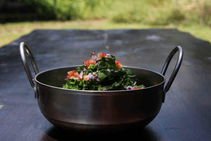 This collard green is available year-round and is often served with <em>ugali</em>.