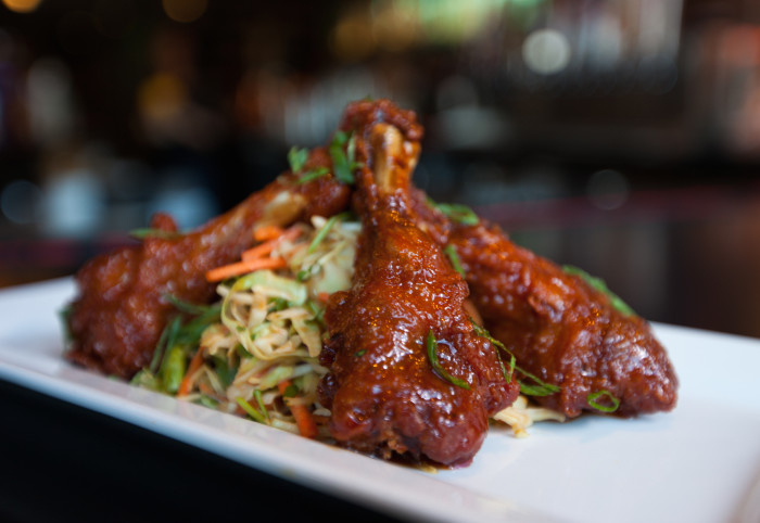 These crispy duck wings are glazed with a hoisin-based sauce that’s tangy, sweet, and savory. (Photo credit: Tom's Urban)