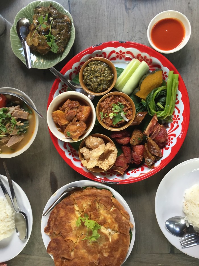 A platter of northern Thai specialties: nam prik noom, pork rinds, and sai oua. 