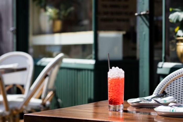 The Unlikely Negroni: a frappé served on crushed ice with fresh pressed orange juice, a mezcal-based version with a little cold brew coffee.