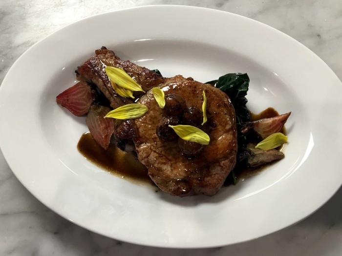 Bar Frances' seasonal dishes like this pork chop with candy cane beets and blistered grapes pair nicely with their vast wine selection. (Photo: Bar Frances/Facebook.)