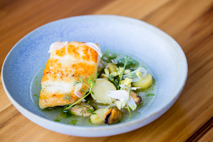 Local halibut, mussels, garlic and lemongrass braissage at Lord Stanley. (Photo: Antoinette Bruno.)