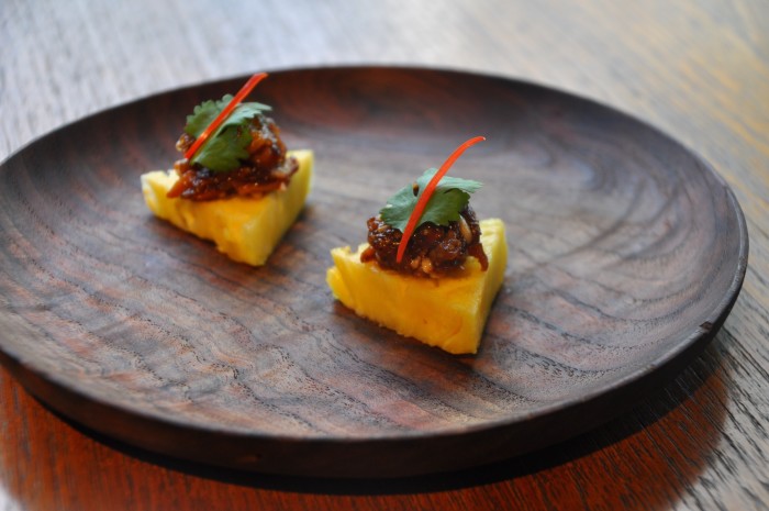 Prik chee fah is paired with pineapple in this Thai dish.