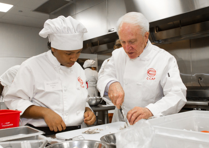 Richard Grausman (right) runs the Careers Through Culinary Arts Program, teaching many high school students about the restaurant industry.