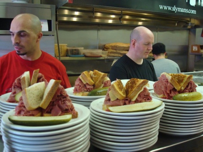 For over 50 years, this humble, family-owned deli has been slinging the city's best (and biggest) corned beef sandwiches. (Photo credit: Slyman's)