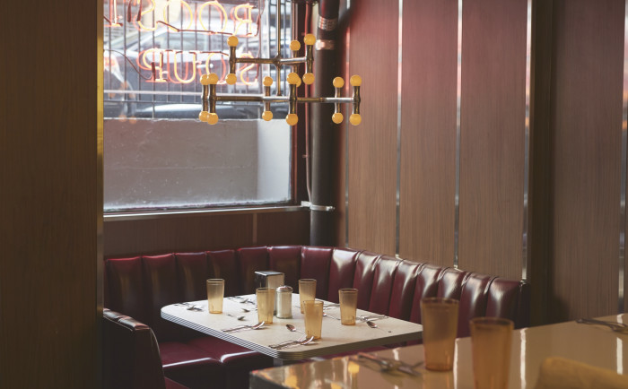 The dark room was converted to an airy chrome and tile luncheonette that’s pleasingly retro.