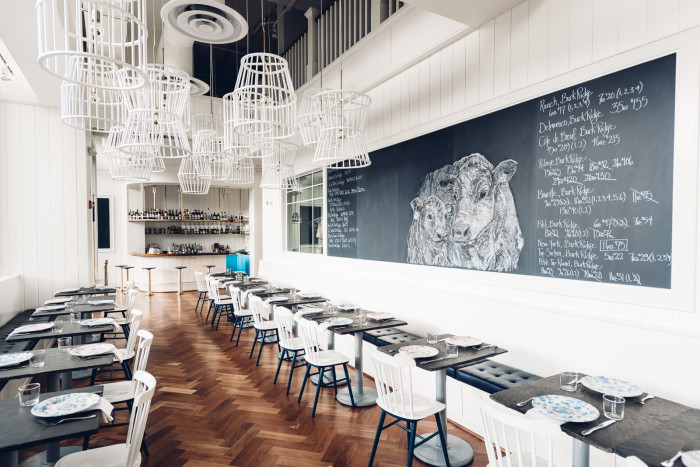 This pretty, contemporary steakhouse by restaurant by Renee Erickson specializes in unusual cuts of beef. (Photo credit: David Dosset)
