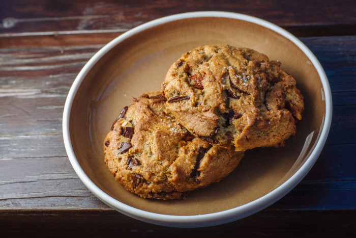 Coquine's famous chocolate chip cookies are studded with artisanal chocolate, sea salt, and smoked almonds. (Photo credit: Joshua Chang)