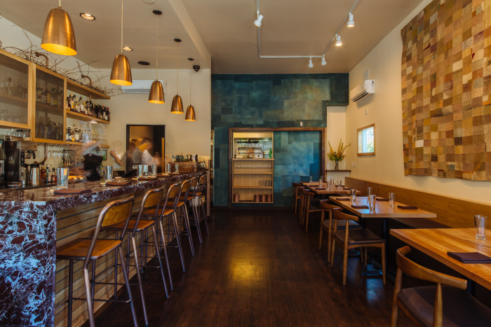 Coquine seamlessly transitions from a casual breakfast and lunch nook to bustling neighborhood restaurant come evenings. (Photo credit: Joshua Chang)