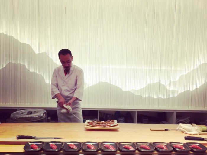 Sushi chef Christ Kinjo shows off his knife skills at MF Sushi. (Photo: Mai Pham.)