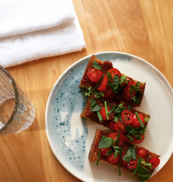 Theodore Rex's tomato toast is halfway between Italian bruschetta and Catalan pa amb tomaquet. (Photo: Justin Yu.)