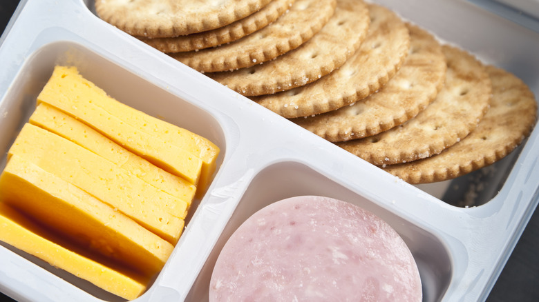 Close-up of Lunchables snack, showing cheese, crackers, and meat