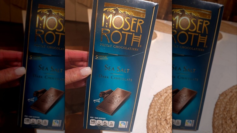 Person holding a Moser Roth Dark Chocolate Sea Salt