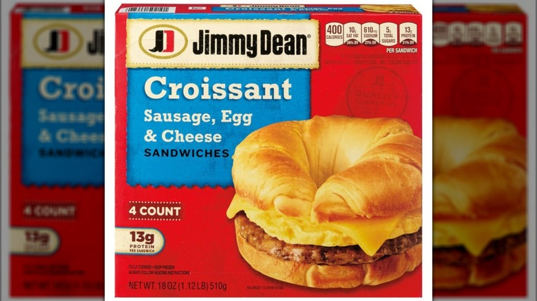 A prepared Jimmy Dean Croissant Breakfast Sandwich sits on a metal spatula