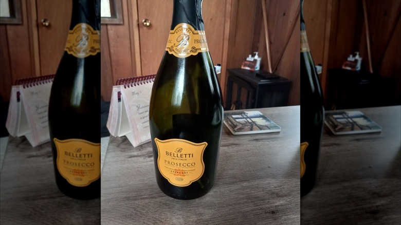 A bottle of Belletti's Prosecco Sparkling Wine from Aldi on a counter
