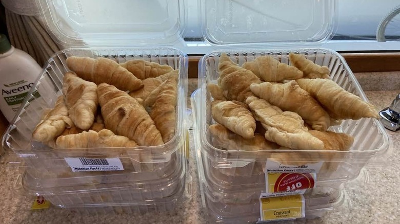 Two open containers of Aldi croissants on a counter