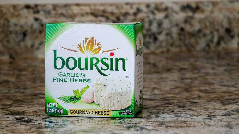 A package of Boursin cheese on a counterop