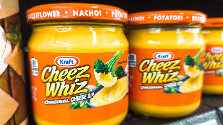 Jars of Cheez Whiz on a supermarket shelf