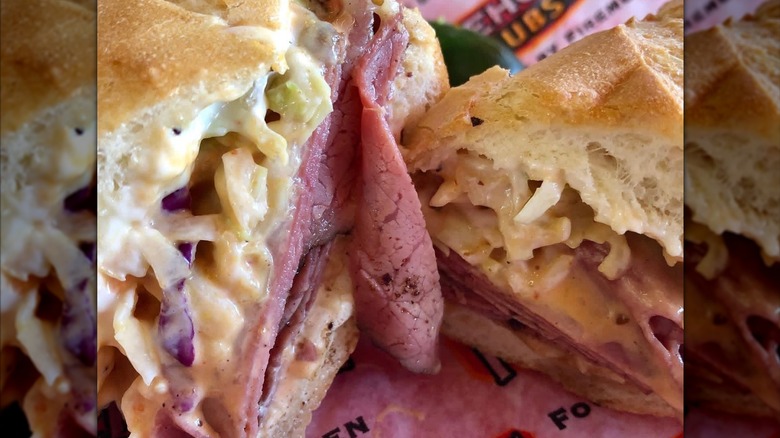 A Firehouse Subs Reuben sandwich is pictured from the cross-section up close.