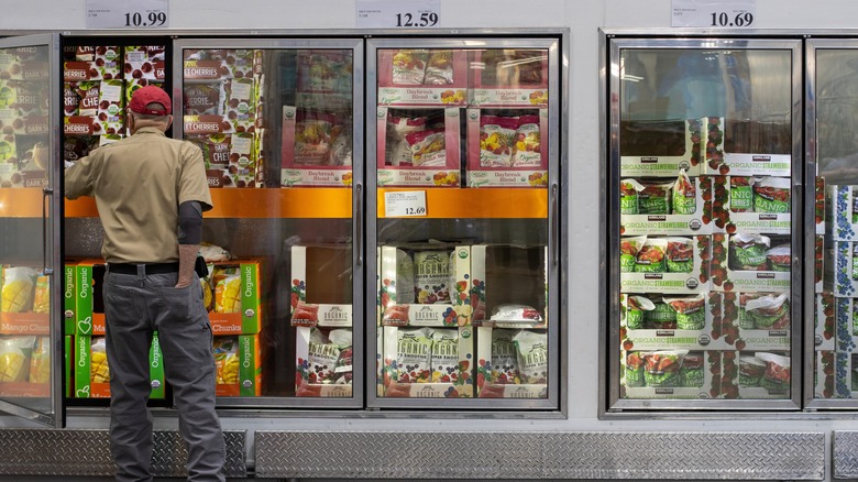 Older man shopping in Costco freezer section
