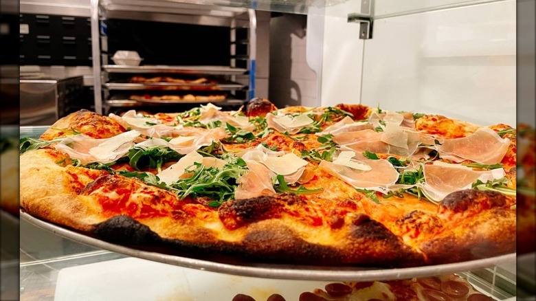 A prosciutto and arugula pizza at Forbidden Pizza in New Orleans, LA