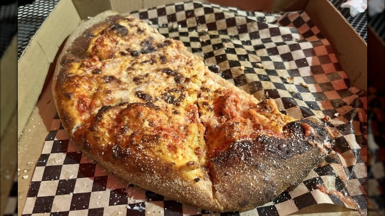 Closeup of half a small cheese pizza at Royal's Woodfire Pizza in New Orleans, LA