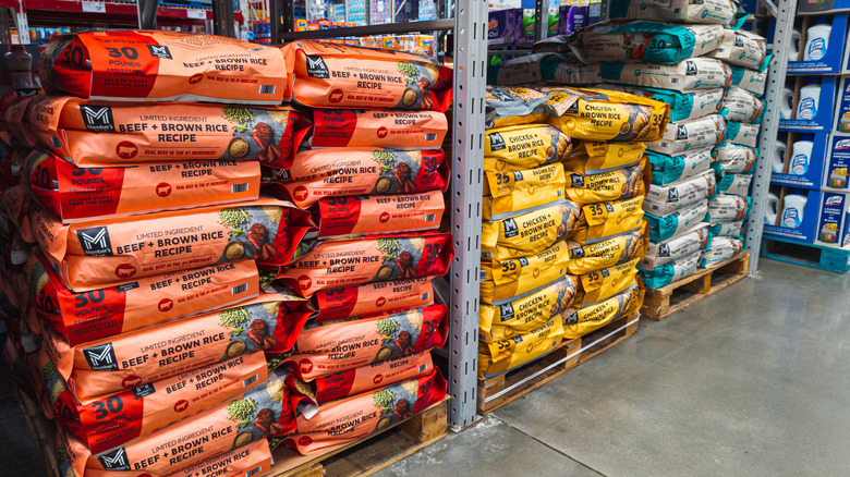 Pallets of Member's Mark dog food stacked in a warehouse