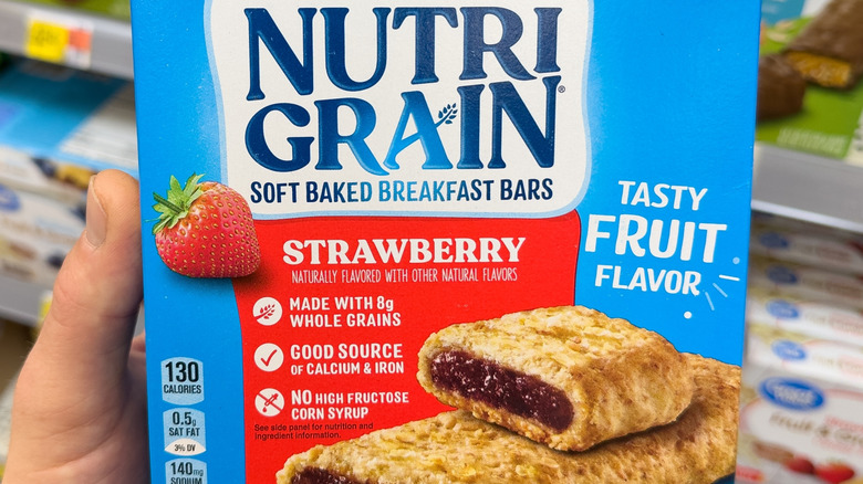 Hand holding a box of Nutri-Grain Strawberry Breakfast Bars