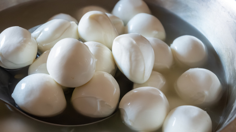 Fresh buffalo mozzarella balls in water