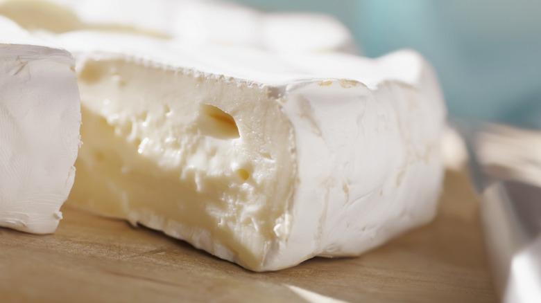 Close-up of a wedge of triple cream brie