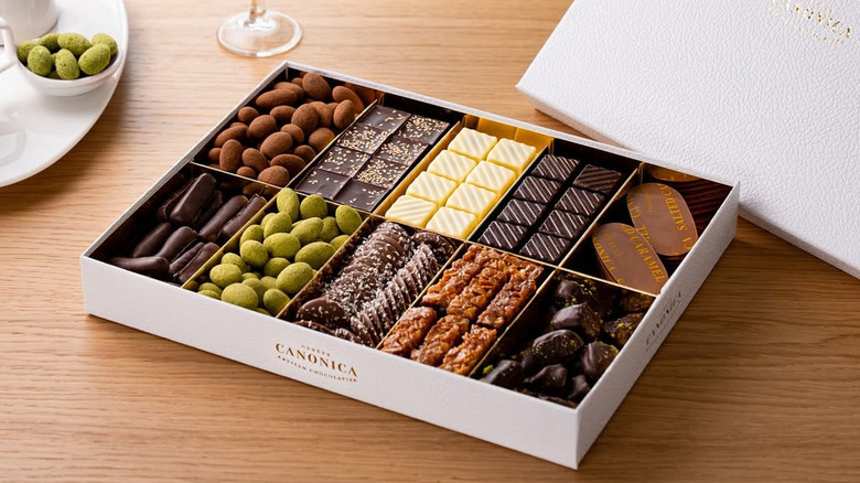 Box of Canonica chocolates on a wooden table