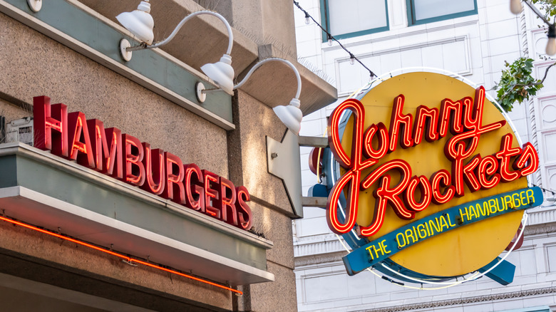Neon Johnny Rockets sign jutting out of a building corner