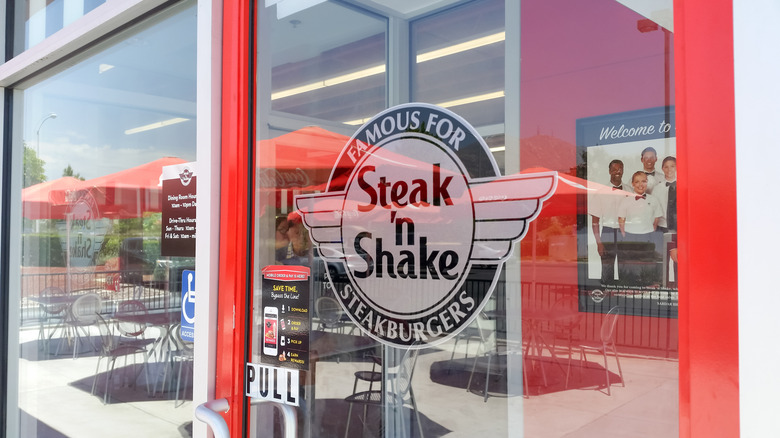 Steak 'n Shake logo on a glass entry door