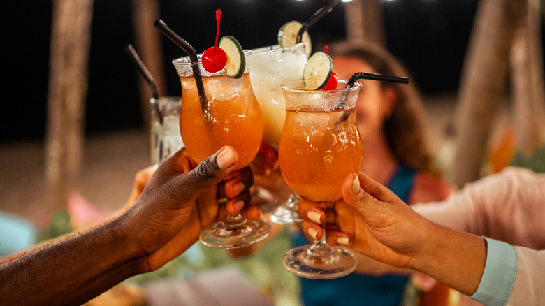 friends clinking cocktail glasses