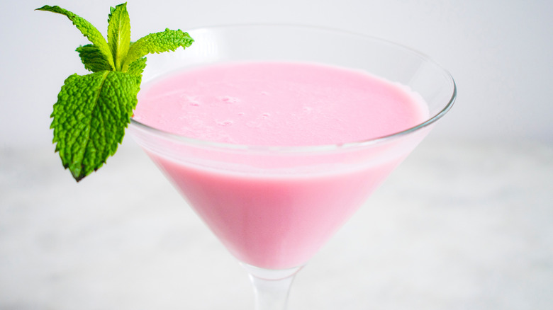 pink creamy drink in a martini glass