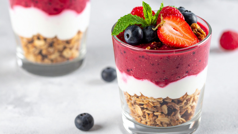 A parfait with fresh mint, granola, and berries