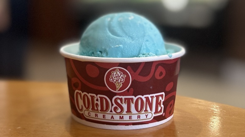 Cold Stone Cotton Candy Ice Cream in a small cup on a wooden table