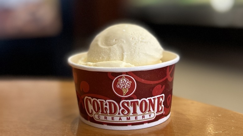 Cold Stone French Vanilla Ice Cream in a small cup on a wooden table