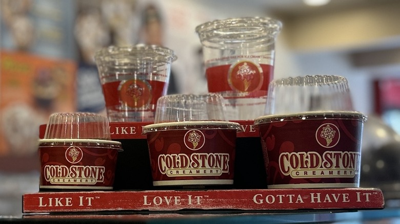 Three Cold Stone ice cream cup sizes displayed side by side with labels to indicate the name of each size