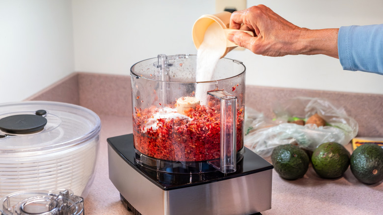 food processor being used on a countertop