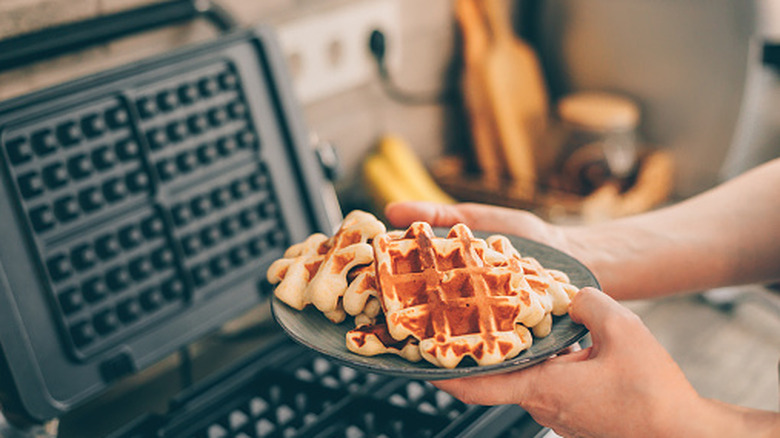 a waffle iron making waffles
