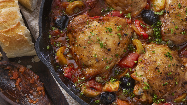 Braised chicken with olives and peppers.