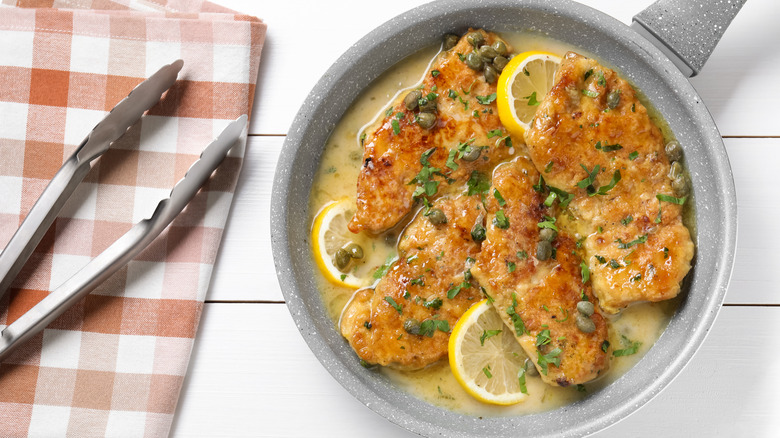 A chicken piccata dish, it has a lemon, caper and herb sauce