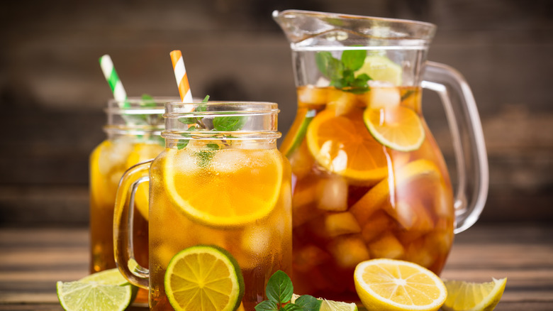 pitcher of iced tea sitting on counter 