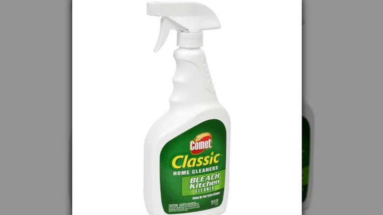 A bottle of Comet Classic kitchen cleaner with bleach sits against a white background